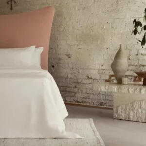 Natural materials with organic bed linens Photographed by Toby Mitchell.