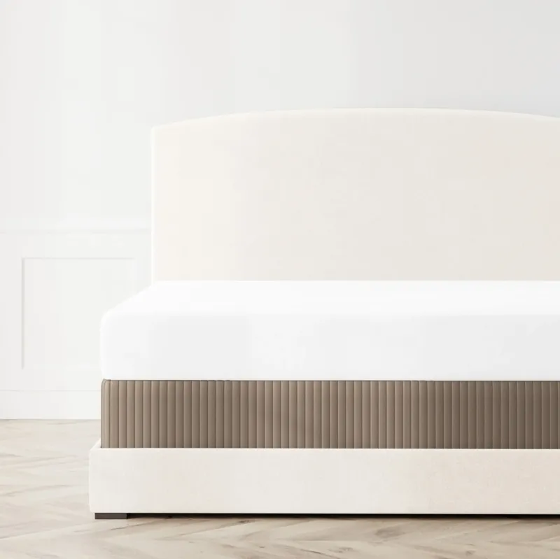 Ann Gish Charmeuse Channel Quilt box spring cover in taupe, pleated detail on styled bed.