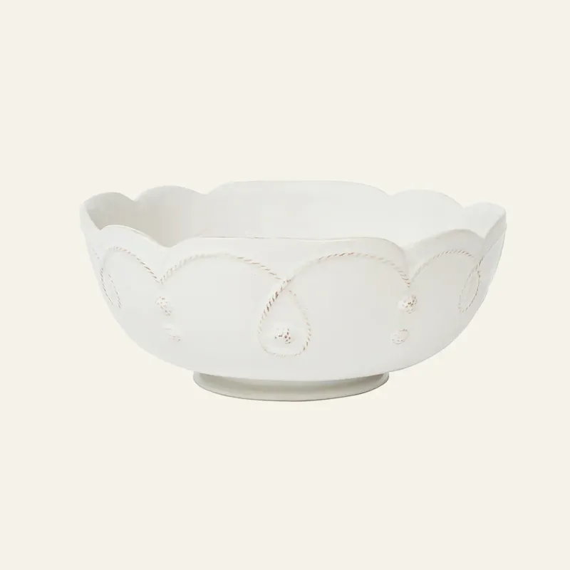 Juliska Jardins Du Monde white ceramic serving bowl with scalloped rim and rope detail.