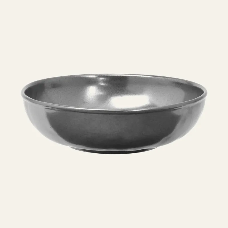 Juliska pewter stoneware coupe bowl with glossy glaze finish on ivory background.