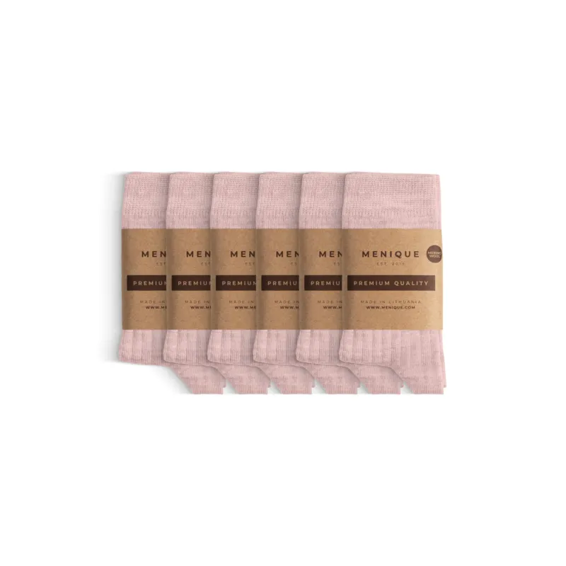 Six pairs of thin ribbed kids’ socks in soft pink, neatly folded and wrapped with Menique brown paper labels that read ‘Premium Quality.
