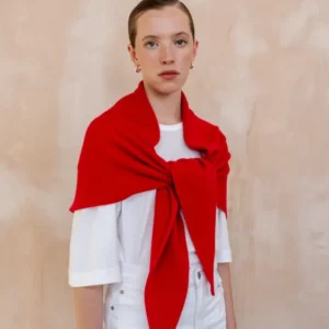 Model wearing a Large Merino Triangle Scarf in Red by TBCo, styled over a white shirt against neutral background