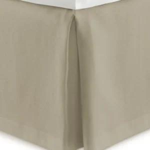 Peacock Alley Mandalay tailored linen bed skirt in warm sand with pleated corners.