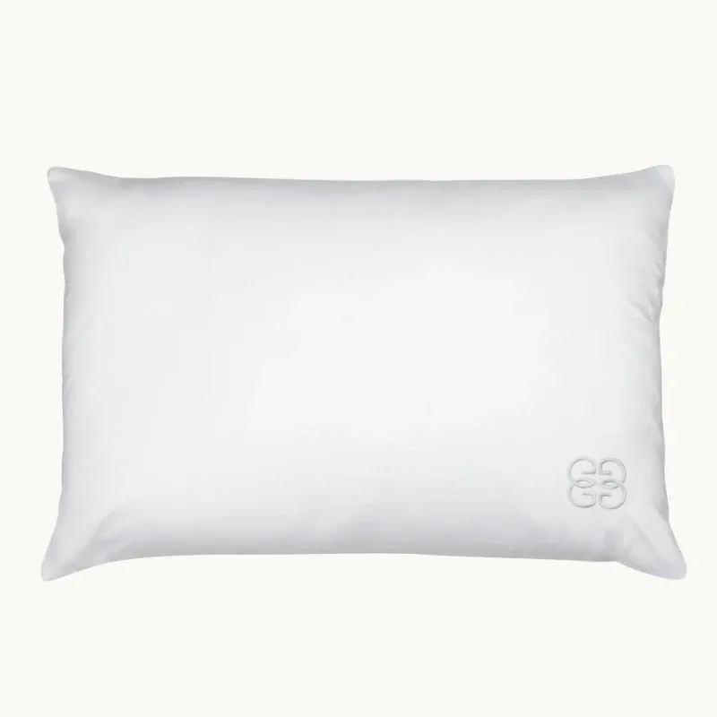Gingerlily London white silk pillow with embroidered logo on ivory background.