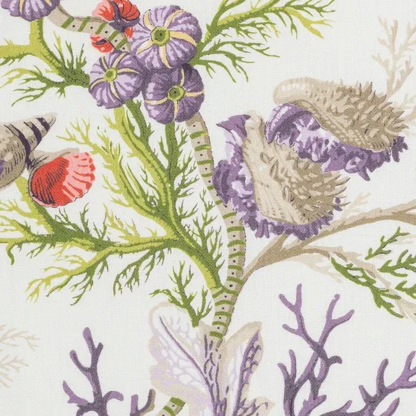Close-up of Del Tesoro linen tablecloth with purple coral, shells, and green botanical print.