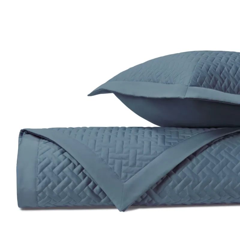 Home Treasures Basketweave quilted coverlet set in slate blue with woven texture pattern.