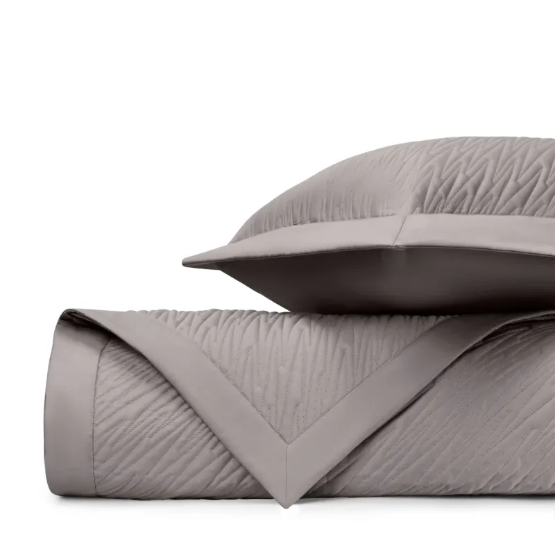 Home Treasures Blaze quilted coverlet and euro sham set in taupe with wave texture.