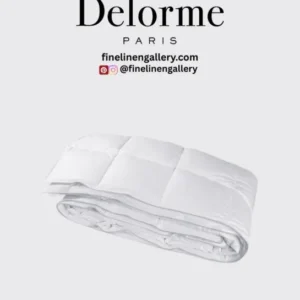 Yves Delorme Caribbean Light duvet cover in soft, light-colored bed linen with subtle Caribbean-inspired patterns.