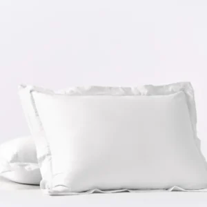 Coyuchi Cloud Soft Sateen pillow sham in white, two shams stacked against soft background.