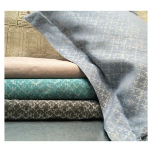 Leitner Wendling decorative pillow fabric in slate, teal, blush, and charcoal damask patterns.